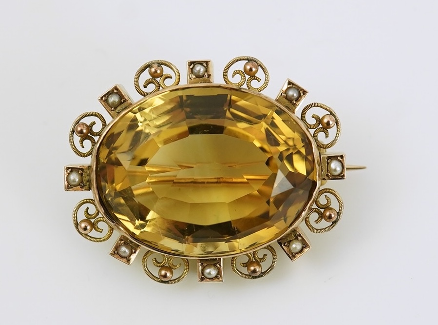 A late Victorian 9ct gold, citrine and seed pearl cluster set oval brooch